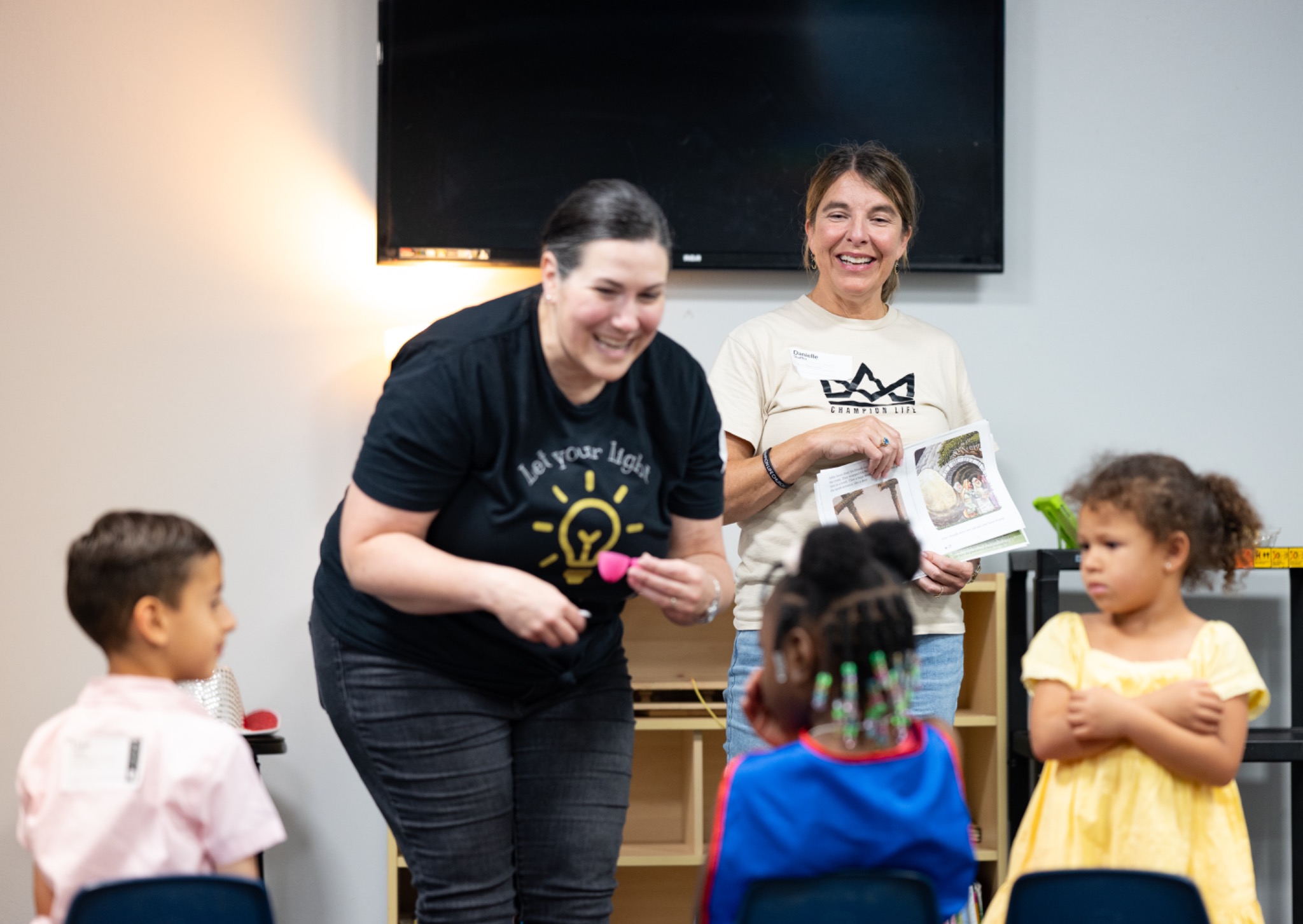 Champion Kids teacher engaging with children